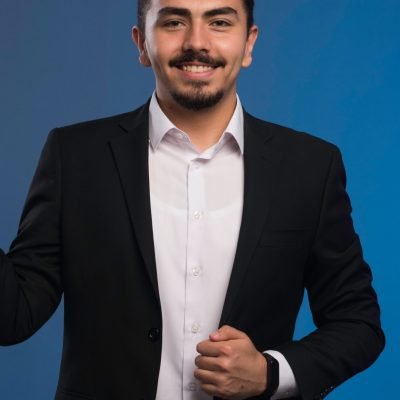 businessman-black-suit-promoting-something-2-min